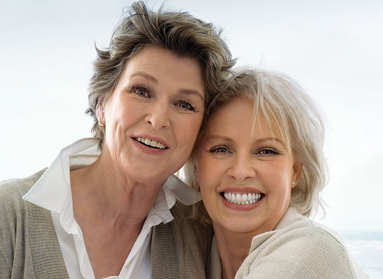 Photo of two smiling women. Link to Life Stage Gift Planner Ages 60-70 Situations.