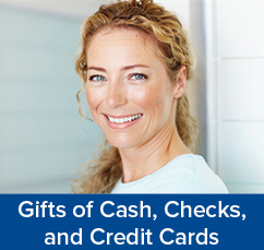 A smiling woman. Gifts of Cash, Check, and Credit Cards Rollover